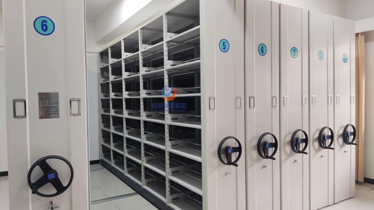 Manual compactor shelving installation with hand wheels